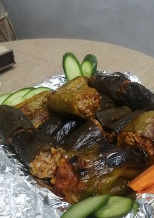 A picture of Stuffed Eggplant, Bell Peppers, and Zucchini with Rice.