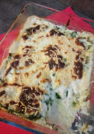 Une photo de °Gratin de ravioles mozzarella et épinards °