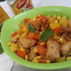 A picture of Crumb fried chicken with veggies.
