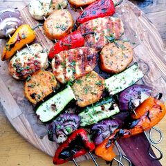 A picture of Grilled halloumi and vegetable skewers.