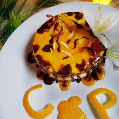 A picture of 4 in 1 orange mousse sponge cake.