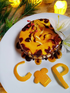 A picture of 4 in 1 orange mousse sponge cake.