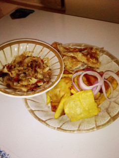 A picture of Fried sweet potatoes with cabbage sauce& fried eggs.