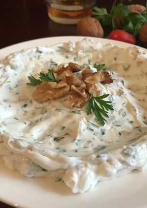 A picture of Labneh with Onions, Parsley, and Walnuts.