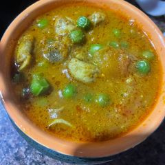 A picture of Mushrooms matar masala.
