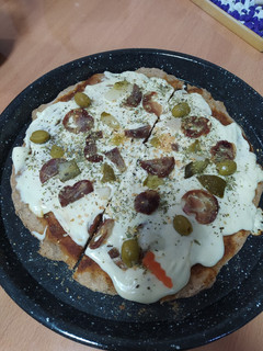 Una foto de Pizza de harina integral