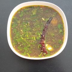 A picture of Tamarind Rasam.