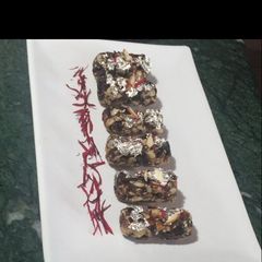 A picture of Dates and nuts rolls.