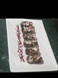A picture of Dates and nuts rolls.