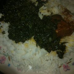 A picture of White rice and local soup.