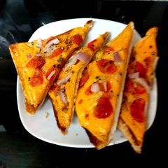 A picture of My Late night Cheese, Onion and Tomatoes Melted on toast🤩.