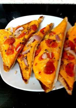 A picture of My Late night Cheese, Onion and Tomatoes Melted on toast🤩.
