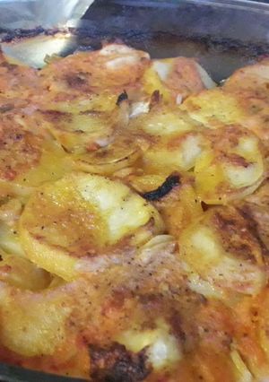 A picture of Baked potato in tomatoe sauce.