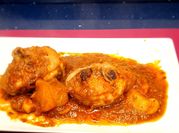 Una foto de ossobuco a la italiana con champiñones