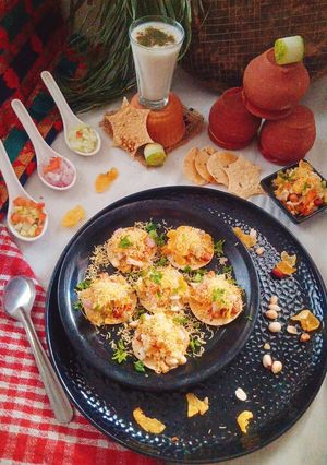 A picture of Papad Sev Puri Chaat with Raw Mango Salsa.