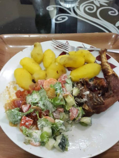 A picture of Boiled potatoes,fried chicken and salad.