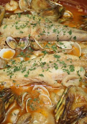 A picture of Monkfish Tails with Shrimp and Clams in Sauce.