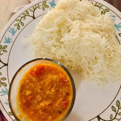 Tamil style Idiyappam And Tomato Kurma A picture of Tamil style Idiyappam And Tomato Kurma.