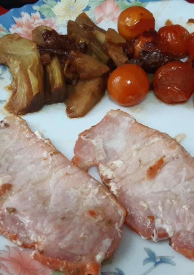 Una foto de Guarnición de tomates cherry y alcachofas salteados a la soja