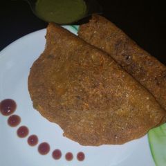 A picture of Masoor daal carrot chila.