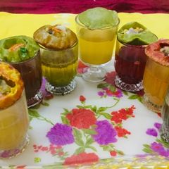 A picture of Panipuri (7 types of water with 4 flavour  of  puries).