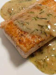 A picture of Salmon with apple and herb beurre blanc.