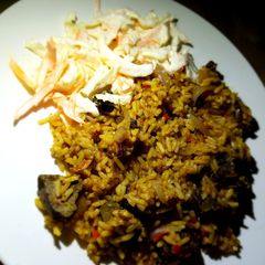 A picture of Jollof rice with liver.