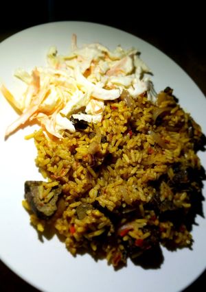A picture of Jollof rice with liver.