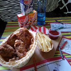 A picture of #THE BIG FIVE#KIDS MENU Kuku Kikapu with Curly Chips.