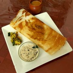 A picture of Masala Dosa with Peanut Chutney.