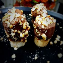 A picture of Peanut chocolate dunked bananas.