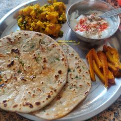 Mooli Methi Paratha with Gobhi Matar Sabji and Gazar Aachar A picture of Mooli Methi Paratha with Gobhi Matar Sabji and Gazar Aachar.