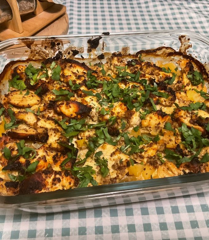 A picture of Chicken Marinated with Two Mustards, Potatoes, and Spices.