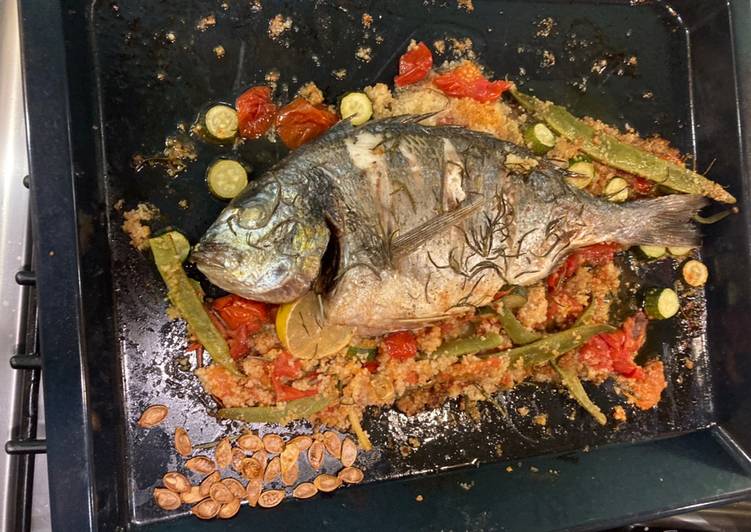 Roasted whole sea bream with all the trimmings on one roasting tin