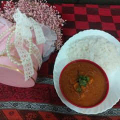 A picture of Prawns ghassi curry mangalory style/ with boil rice.