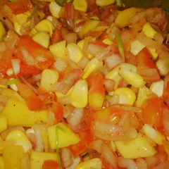 A picture of Corn salad 🌽🍋🥭🍅.