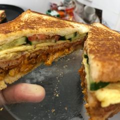 A picture of Chicken tikka and egg sandwich.