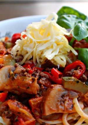A picture of Veggie-packed pasta in fresh tomato sauce.