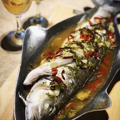 A picture of Steamed fish with Thai sauce.