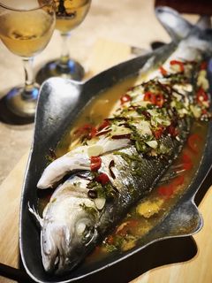 A picture of Steamed fish with Thai sauce.