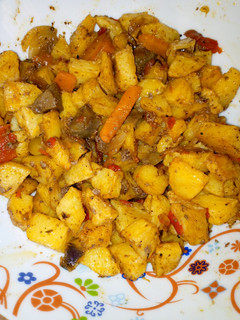 A picture of Diced potatoes in kidney sauce.