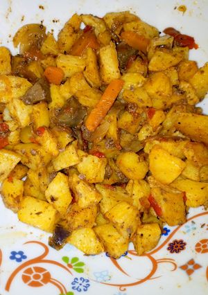 A picture of Diced potatoes in kidney sauce.