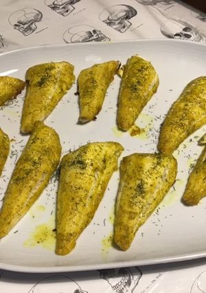 Une photo de Filets de grondin rouge marinés cuits au four