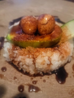 A picture of "Make Your Bed!" (Quail Eggs, Avocado, Cucumber, Rice, Sauce).