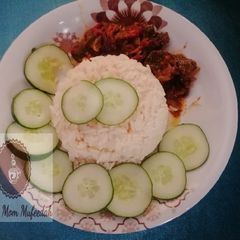 A picture of White rice with kidney sous.