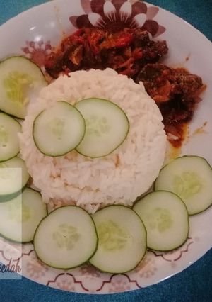 A picture of White rice with kidney sous.