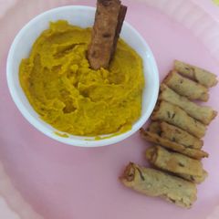 A picture of Carrot dip with crunchy cumin rolls.
