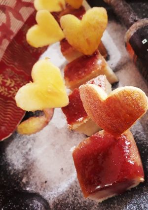 A picture of Apple cake with pomegranate sauce.