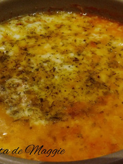 Una foto de Provolone con tomate al horno