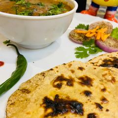A picture of Dal makhni with naan.